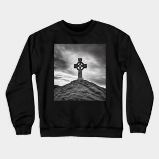 Ancient Celtic Cross on a Burial Mound hill on a hill beneath a stormy, angry sky Crewneck Sweatshirt